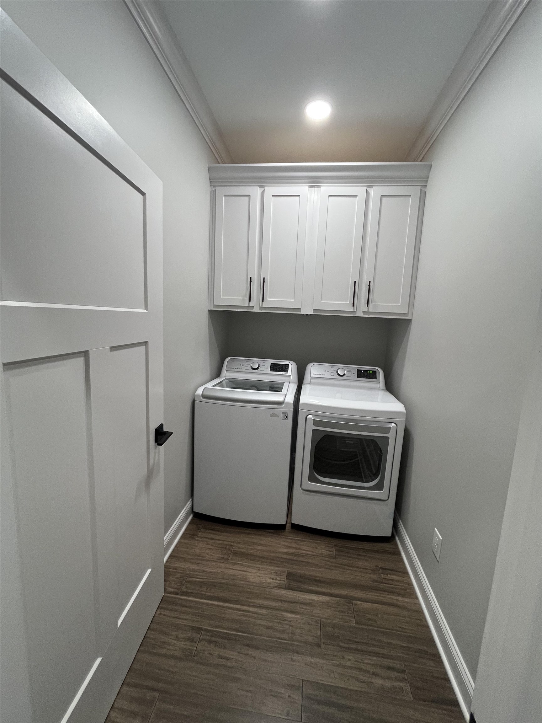 110 RB Drive Savannah, TN 38372 - Photo 17 of 18 a utility room with wooden floor washer and dryer