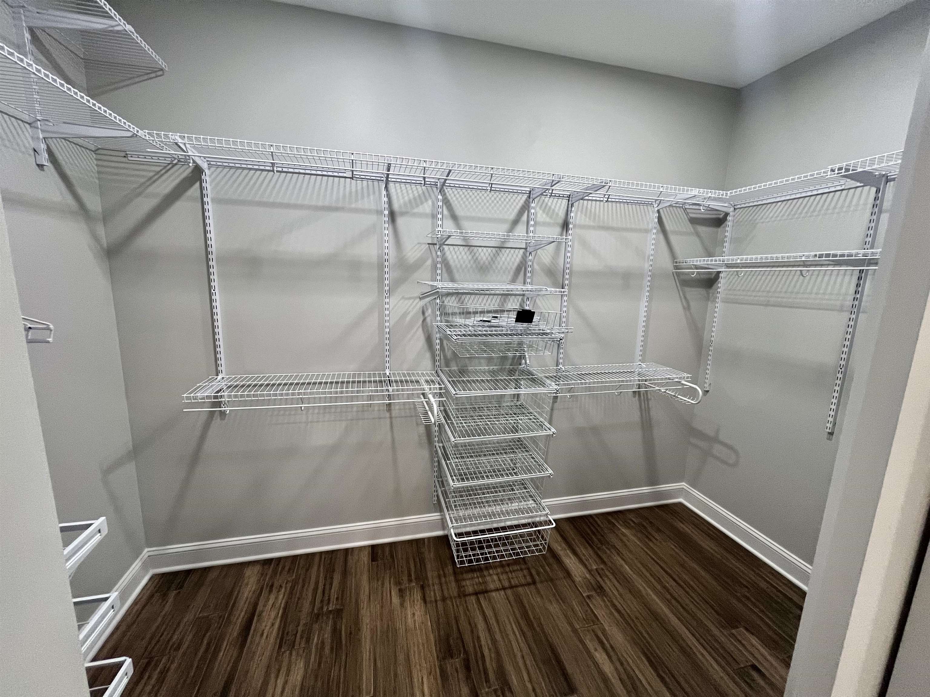 110 RB Drive Savannah, TN 38372 - Photo 18 of 18 a view of walk in closet with wooden floor