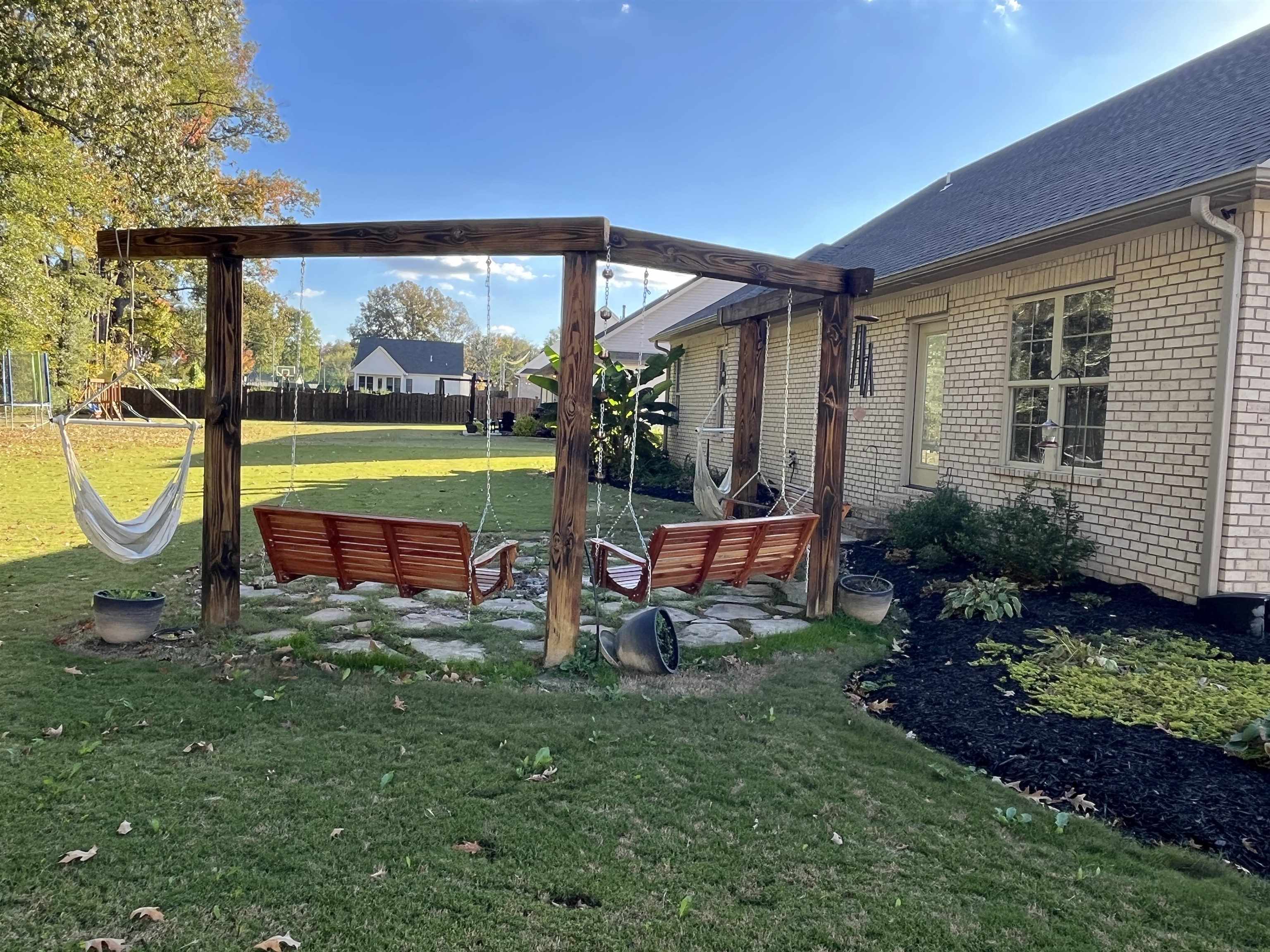 110 RB Drive Savannah, TN 38372 - Photo 4 of 18 a view of a house with a backyard porch and sitting area
