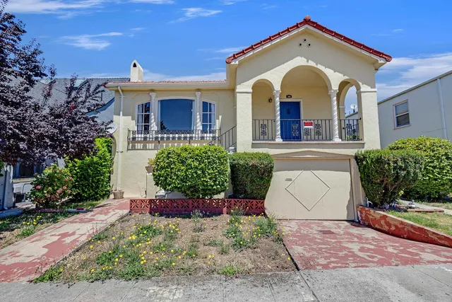 a view of a house with a garden