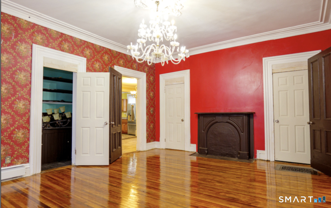 30 Main Street Plainfield, CT 06332 - Photo 9 of 14 a view of livingroom with fireplace and furniture