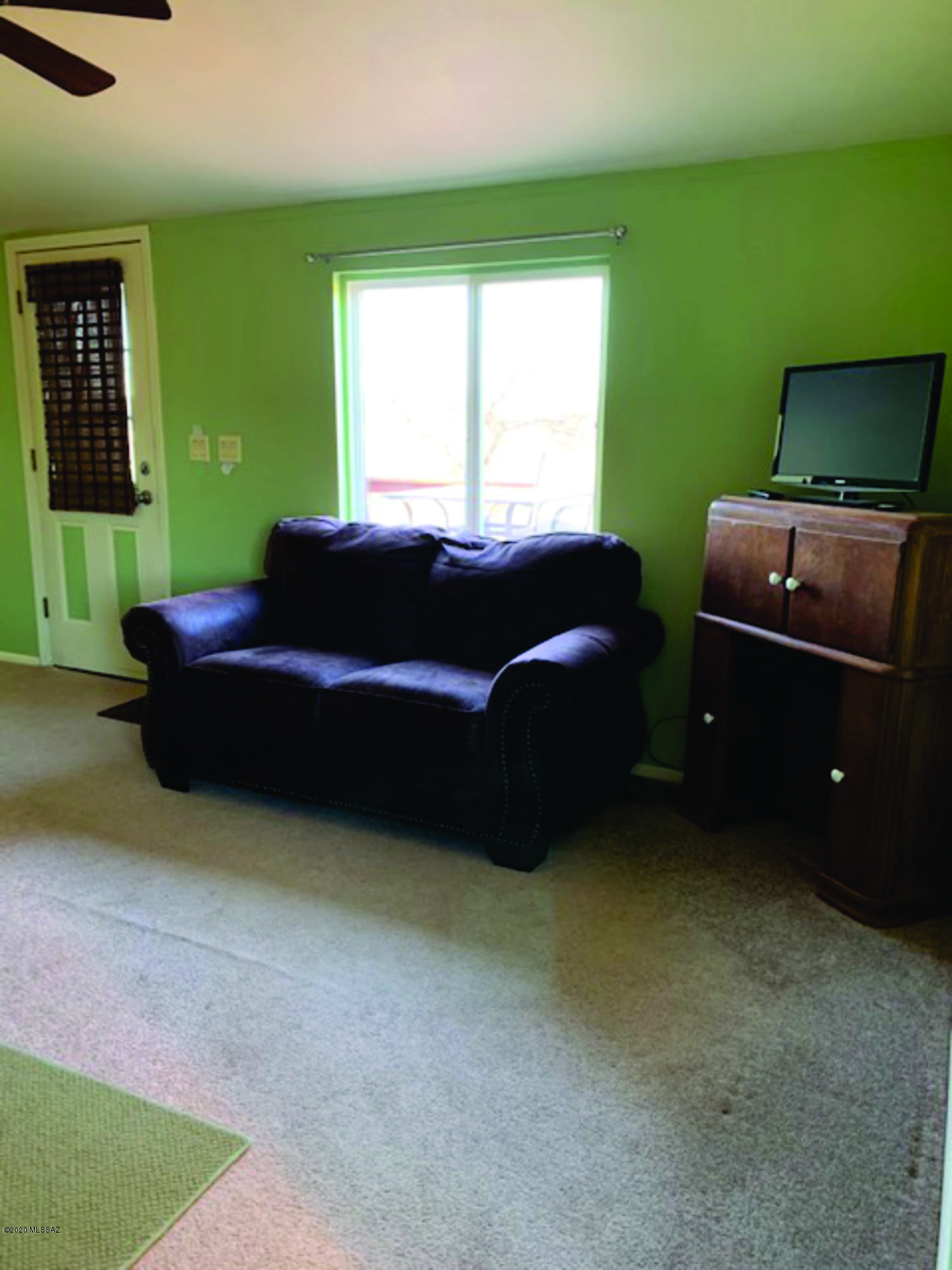 15580 West Hardscrabble Road Arivaca, AZ 85601 - Photo 2 of 14 a living room with furniture and a window