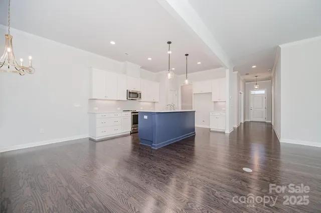 a view of kitchen with cabinets and wooden floor