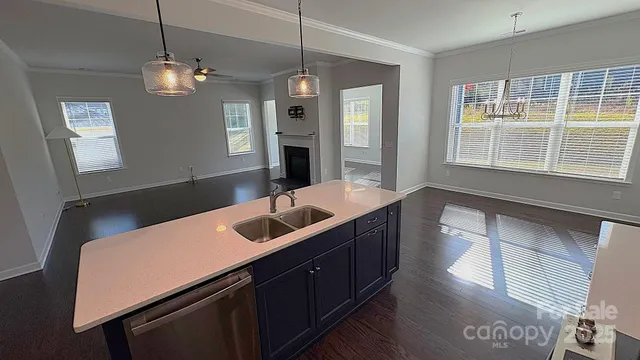 a bathroom with a sink a large mirror and vanity