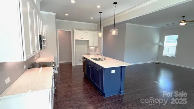 a kitchen with wooden cabinets and sink