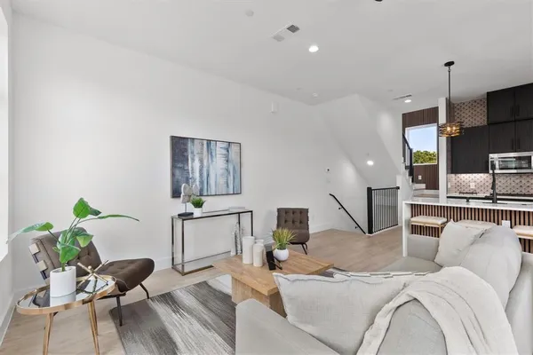 a living room with furniture and a table