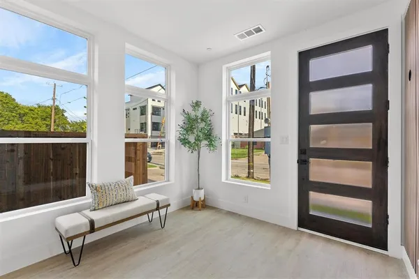 a view of a livingroom with furniture and stairs