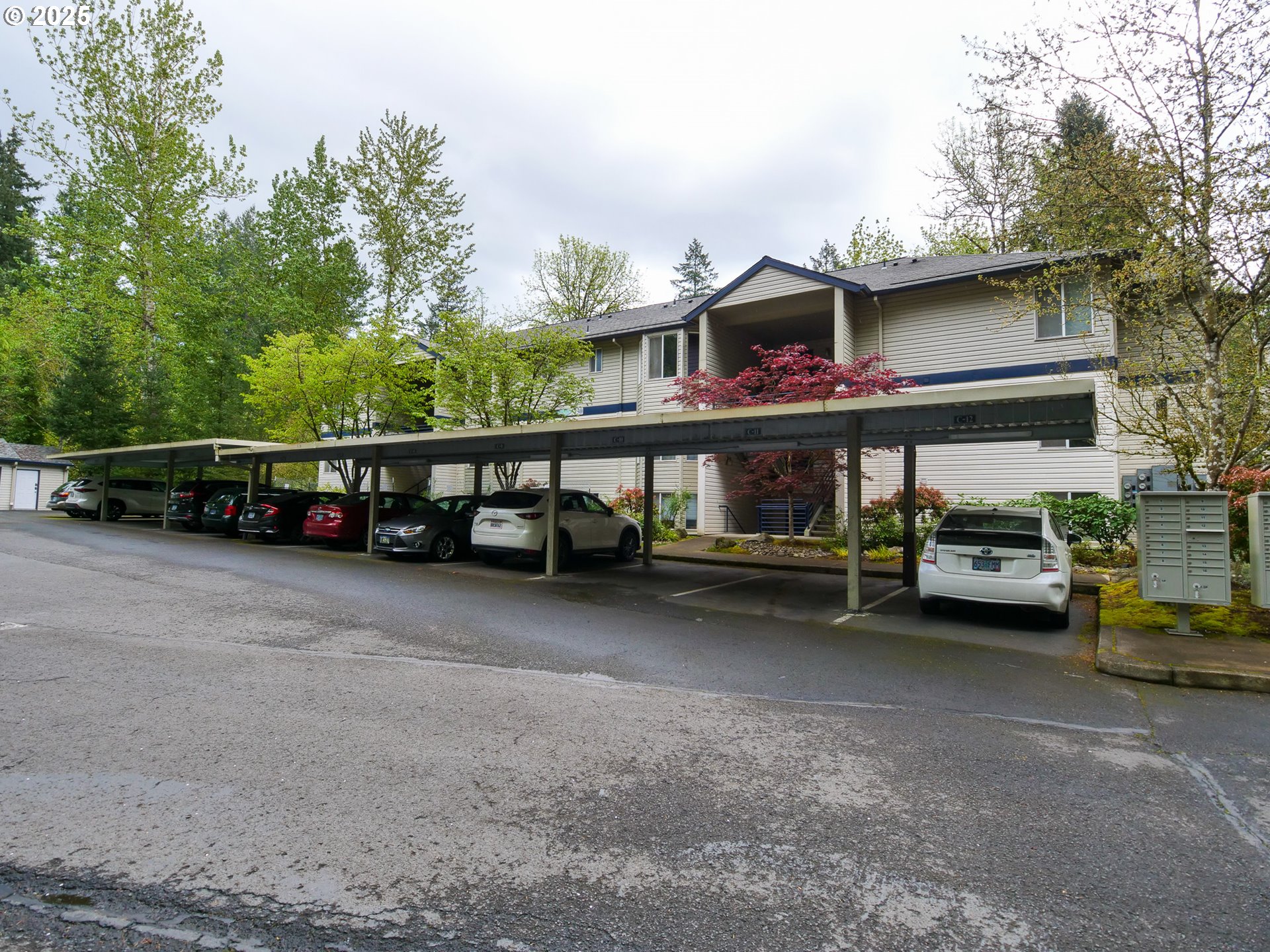 5130 Southwest Multnomah Boulevard, Unit B Portland, OR 97219 - Photo 12 of 36 a view of a car park in front of a building