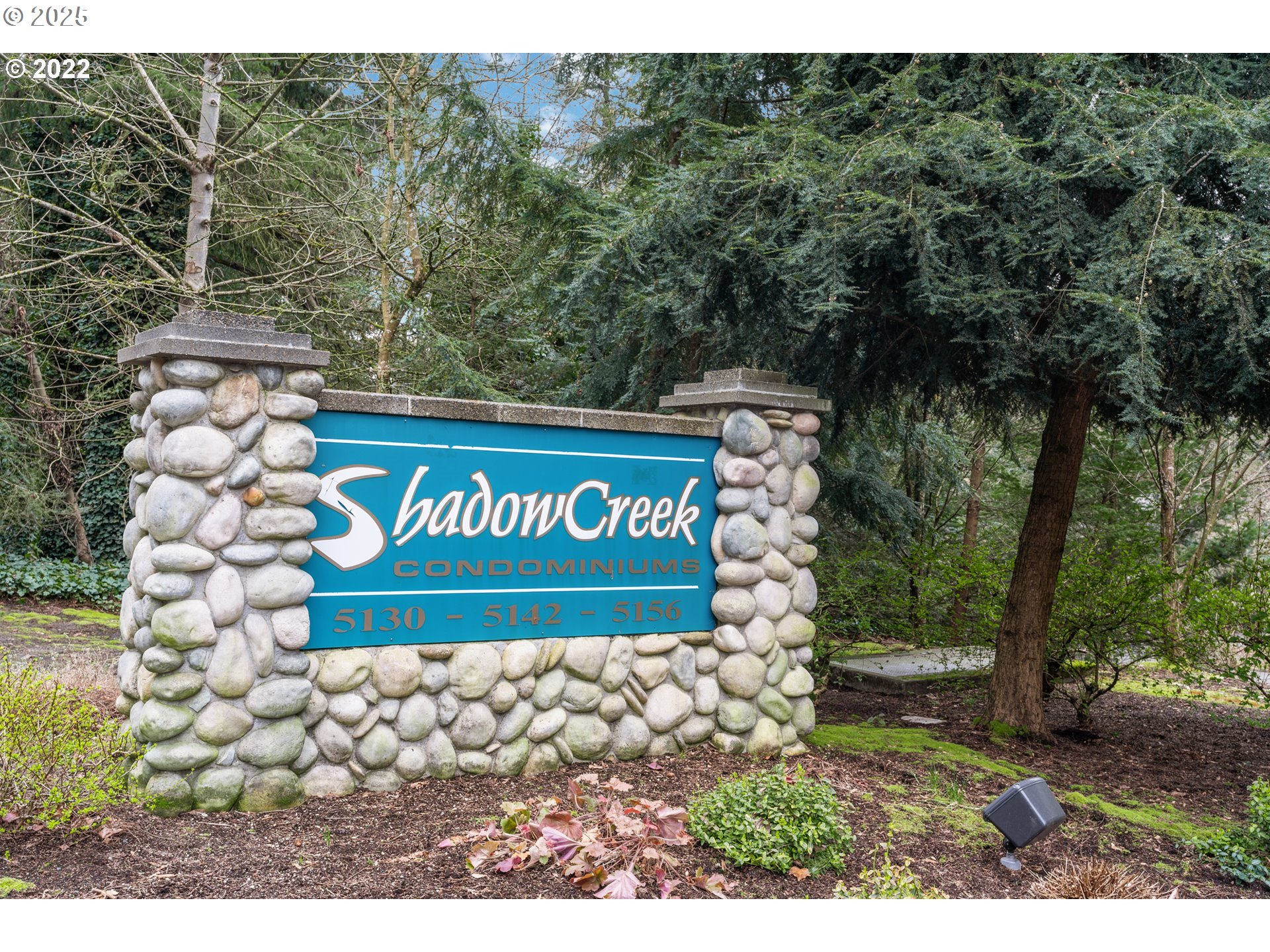 5130 Southwest Multnomah Boulevard, Unit B Portland, OR 97219 - Photo 2 of 36 a view of outdoor space with signage and flags