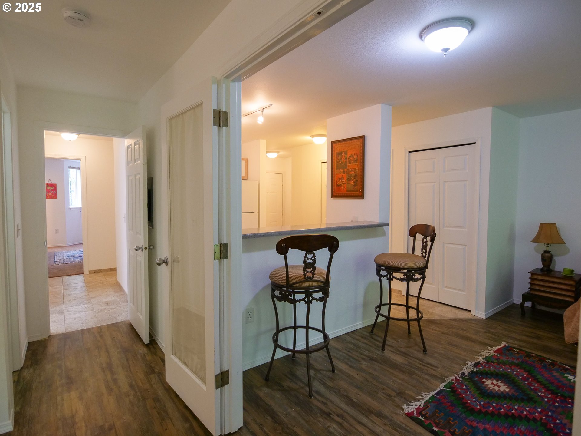 5130 Southwest Multnomah Boulevard, Unit B Portland, OR 97219 - Photo 26 of 36 a view of a dining room with furniture and wooden floor