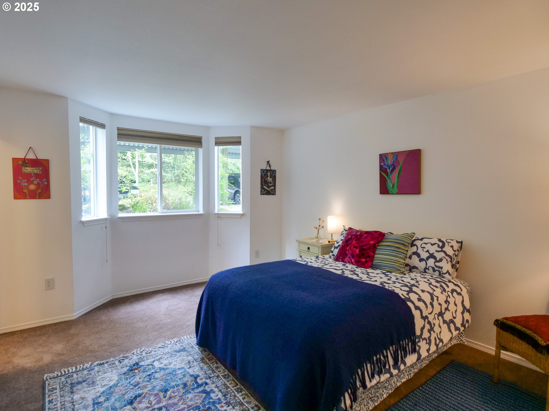 5130 Southwest Multnomah Boulevard, Unit B Portland, OR 97219 - Photo 31 of 36 a bedroom with bed and a window