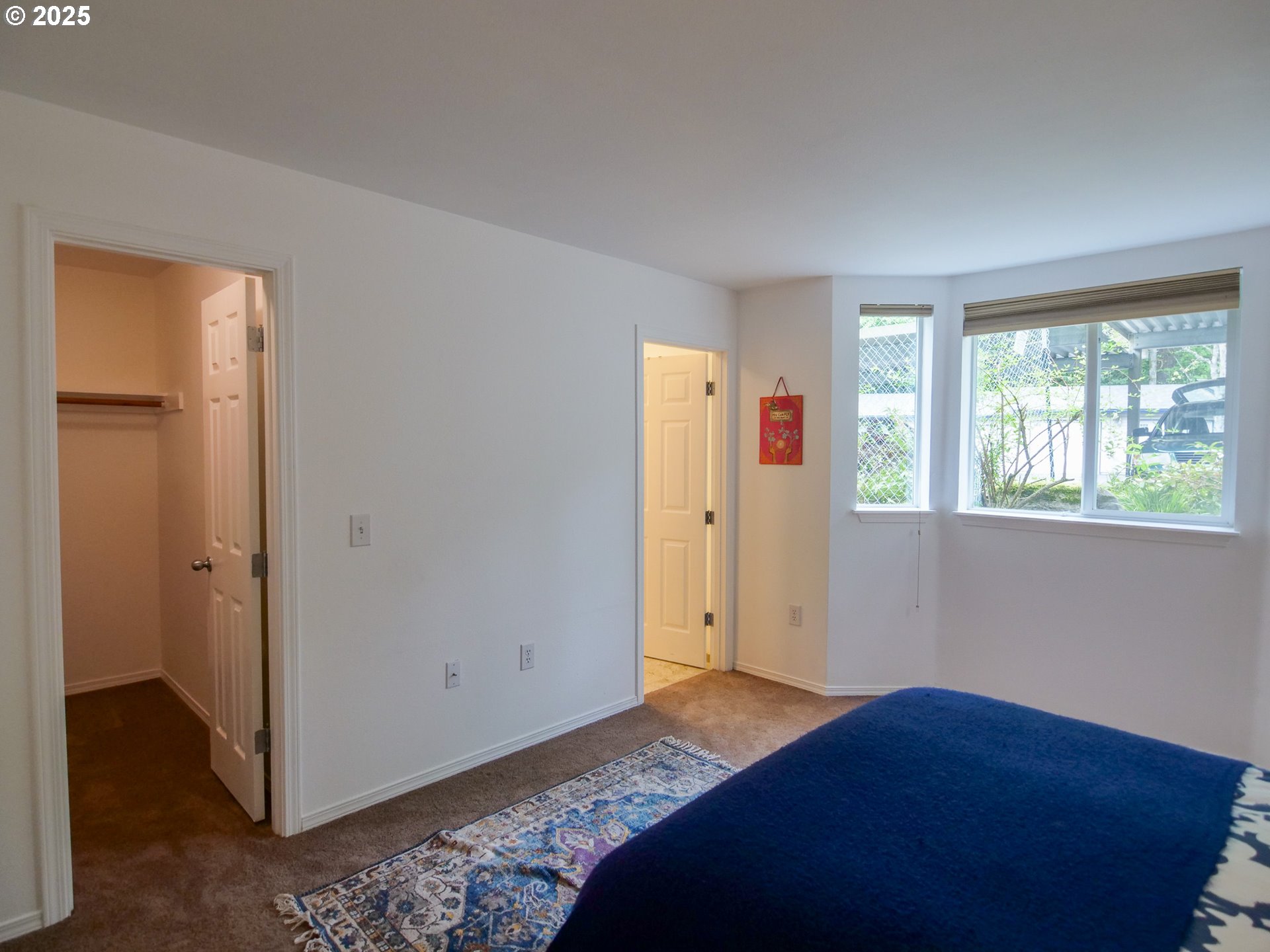 5130 Southwest Multnomah Boulevard, Unit B Portland, OR 97219 - Photo 33 of 36 a bedroom with a bed and a window