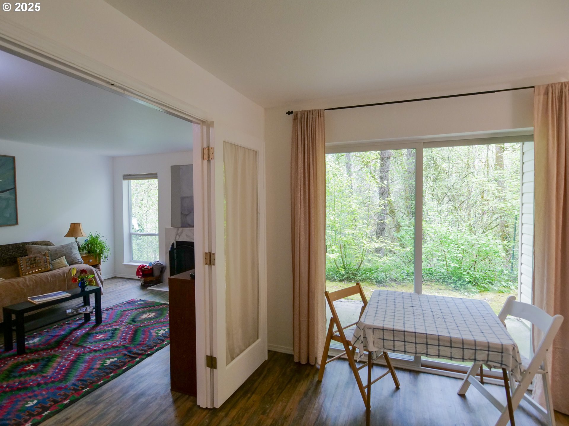 5130 Southwest Multnomah Boulevard, Unit B Portland, OR 97219 - Photo 34 of 36 a living room with furniture and a window