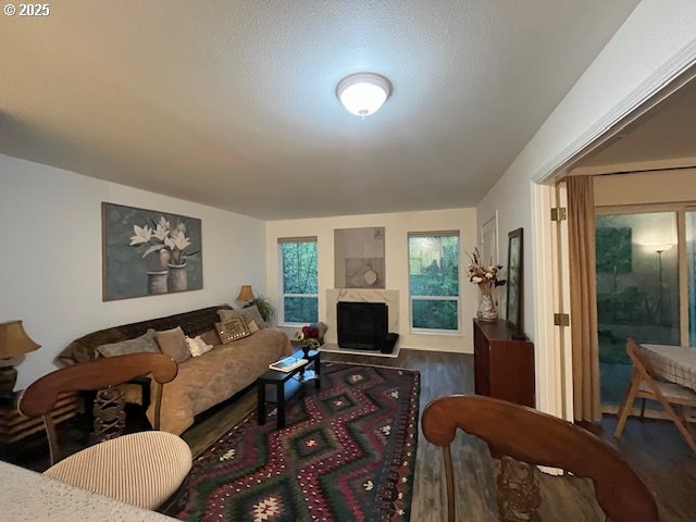 5130 Southwest Multnomah Boulevard, Unit B Portland, OR 97219 - Photo 5 of 36 a bedroom with furniture and a fireplace