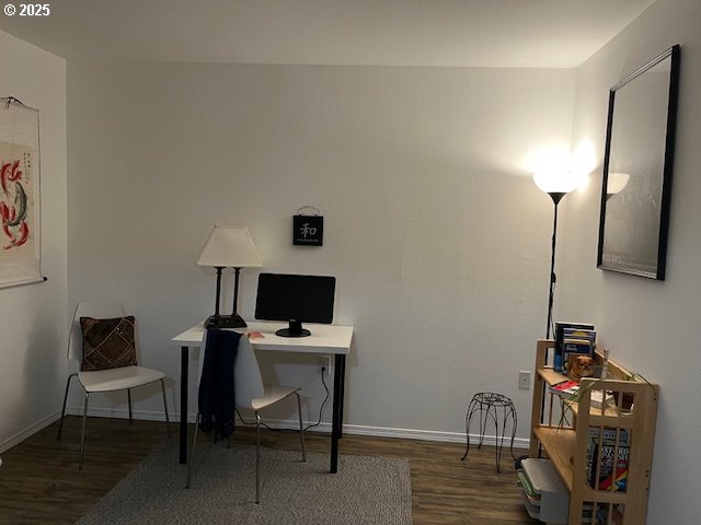 5130 Southwest Multnomah Boulevard, Unit B Portland, OR 97219 - Photo 6 of 36 a view of a workspace with furniture and a flat screen tv