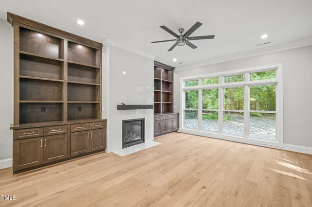 a large kitchen with cabinets and stainless steel appliances