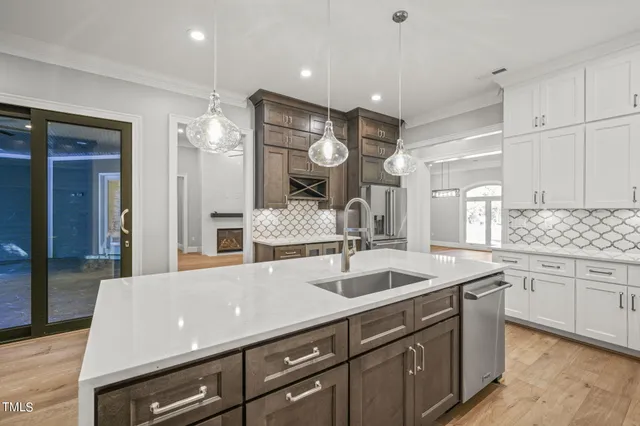 a kitchen with a stove and a white cabinets