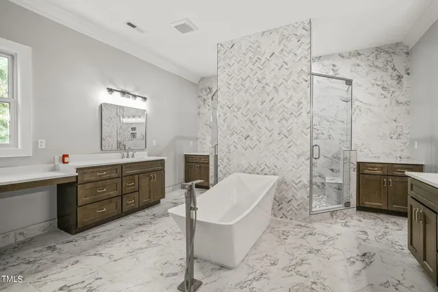 an empty room with ceiling fan and windows