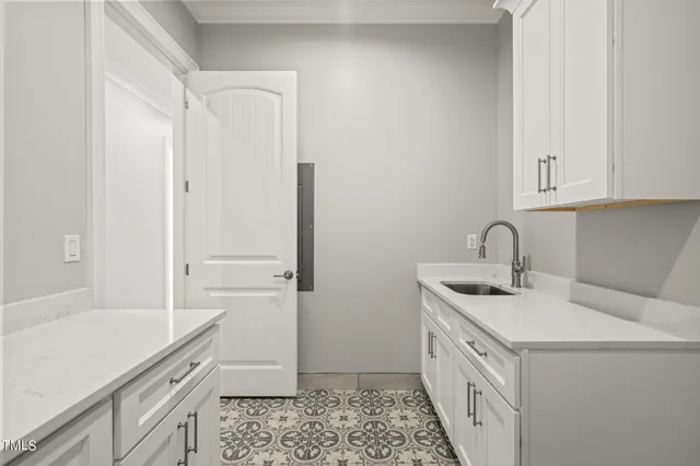 a view of a room with wooden floor and a fireplace