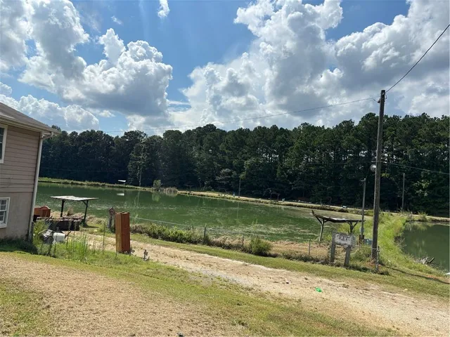 a view of a lake with a yard