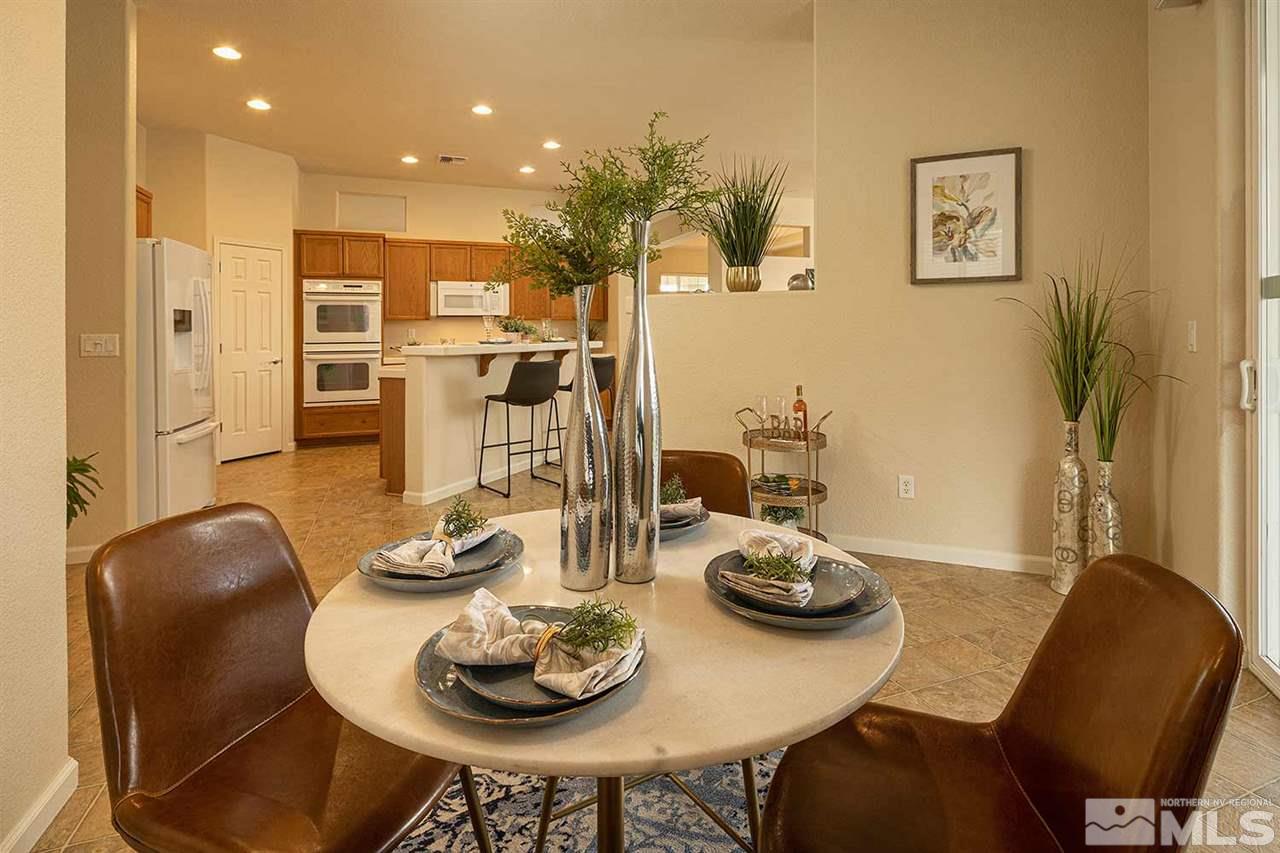 2201 South Tesuque Road Reno, NV 89511 - Photo 13 of 40 a dining room with furniture and wooden floor