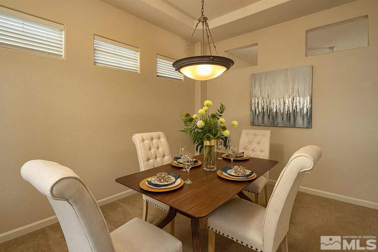 2201 South Tesuque Road Reno, NV 89511 - Photo 17 of 40 a view of a dining room with furniture and chandelier