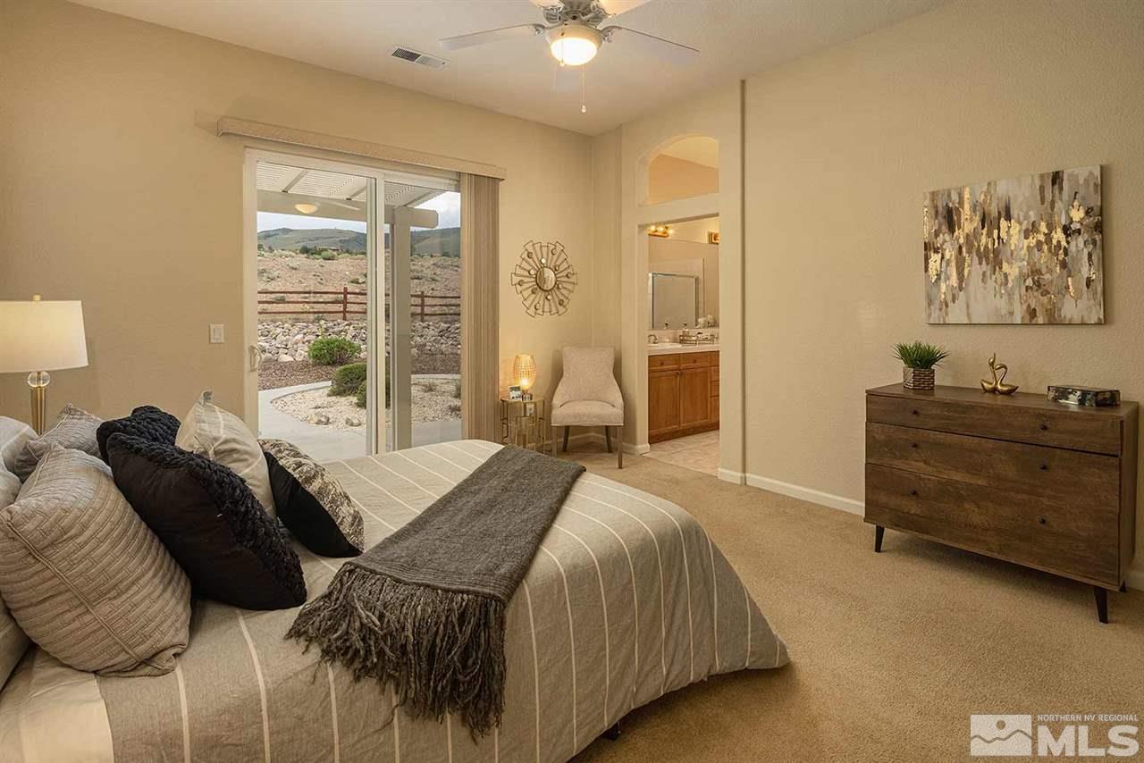 2201 South Tesuque Road Reno, NV 89511 - Photo 23 of 40 a bedroom with a bed and a cabinets