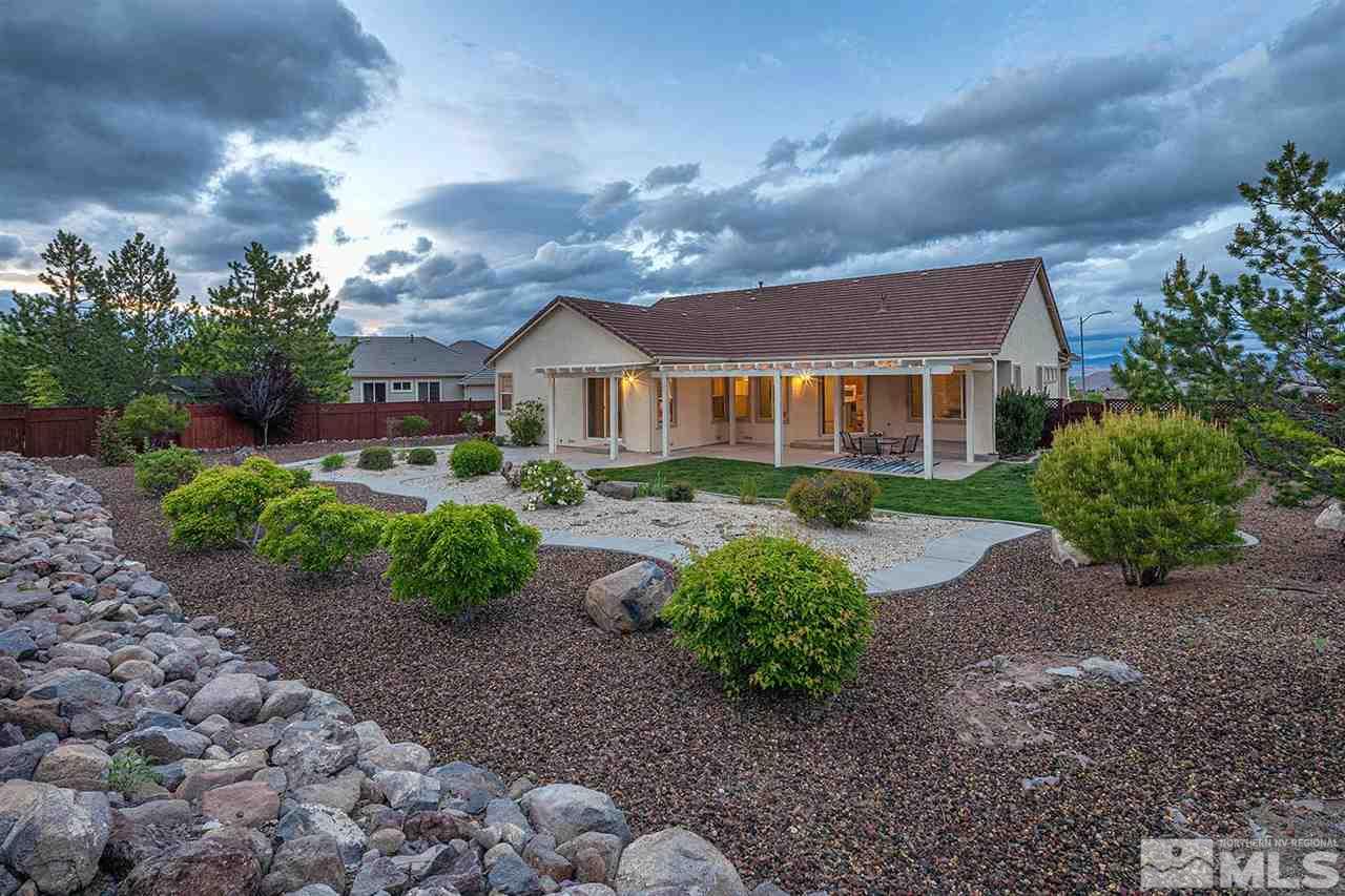 2201 South Tesuque Road Reno, NV 89511 - Photo 36 of 40 a view of a big house with a yard and plants