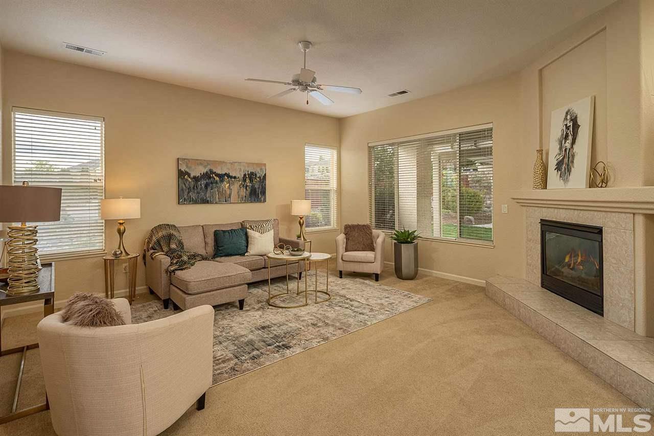 2201 South Tesuque Road Reno, NV 89511 - Photo 5 of 40 a living room with furniture and a fireplace