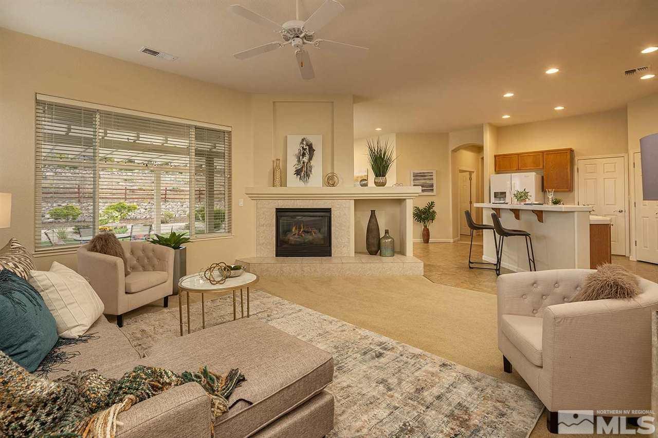 2201 South Tesuque Road Reno, NV 89511 - Photo 6 of 40 a living room with furniture and a fireplace