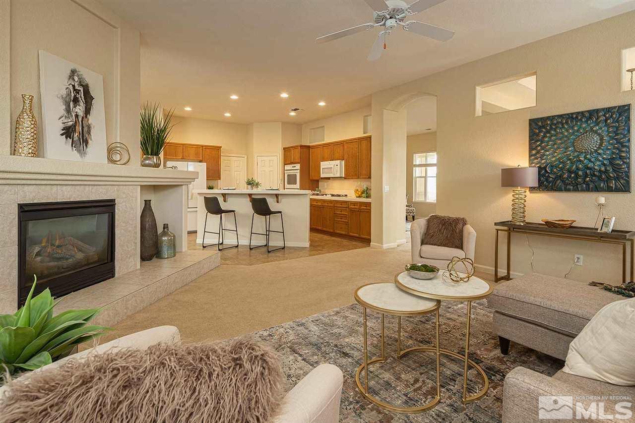 2201 South Tesuque Road Reno, NV 89511 - Photo 7 of 40 a living room with furniture a fireplace and a flat screen tv