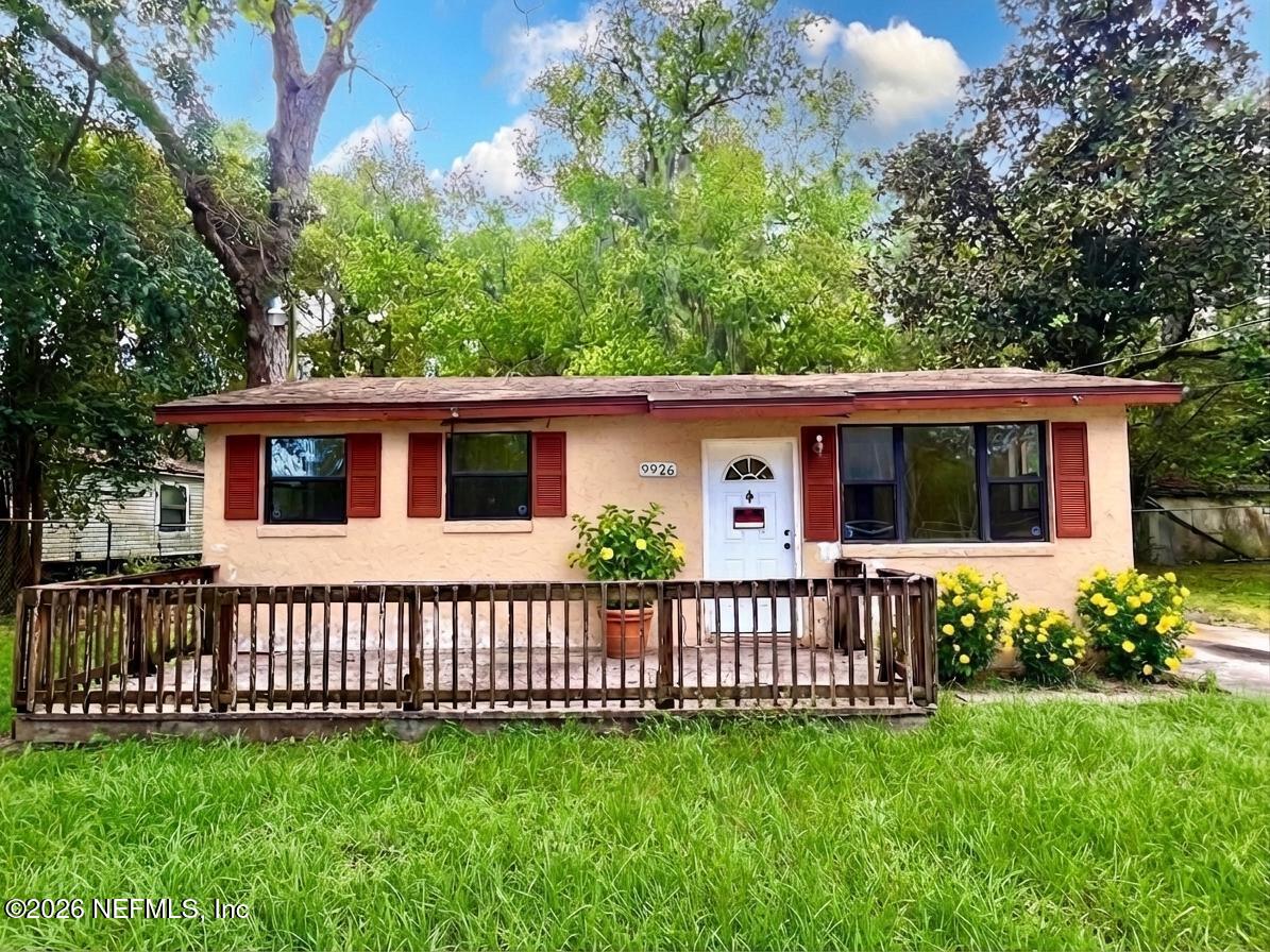 9926 Frankella Road Jacksonville, FL 32208 - Photo 1 of 18 a view of a house with a yard and a garden