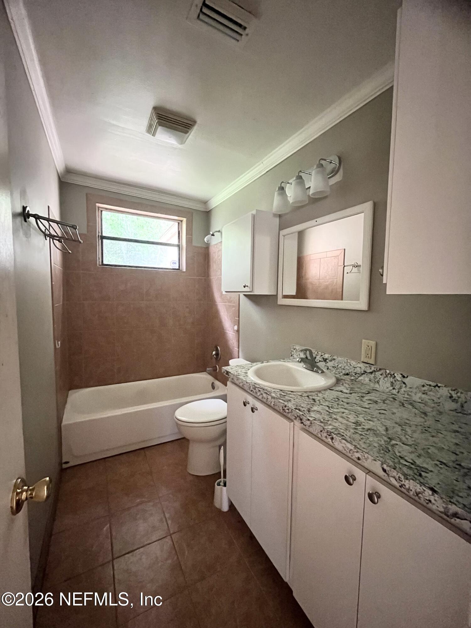 9926 Frankella Road Jacksonville, FL 32208 - Photo 13 of 18 a bathroom with a granite countertop sink toilet and mirror