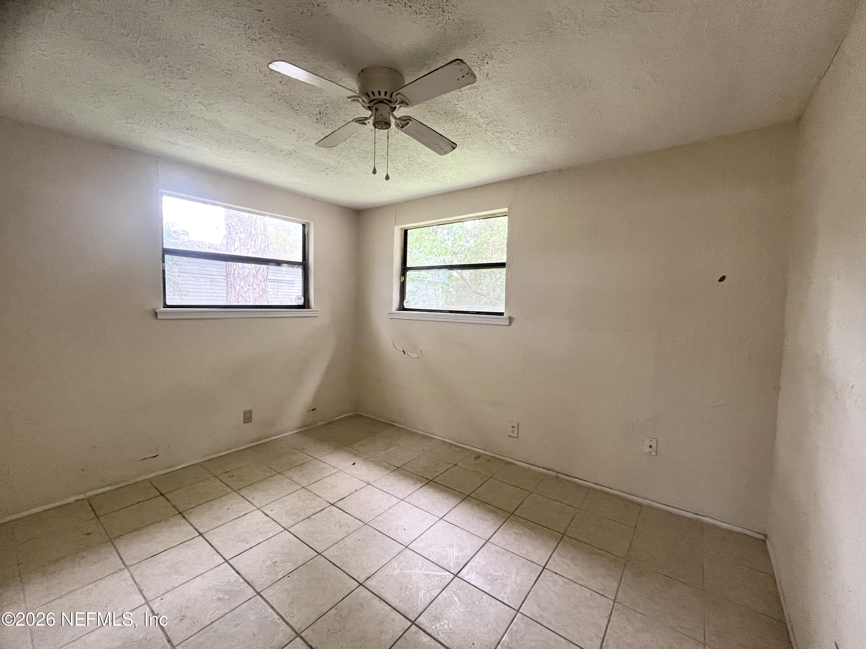 9926 Frankella Road Jacksonville, FL 32208 - Photo 14 of 18 a view of an empty room with a window