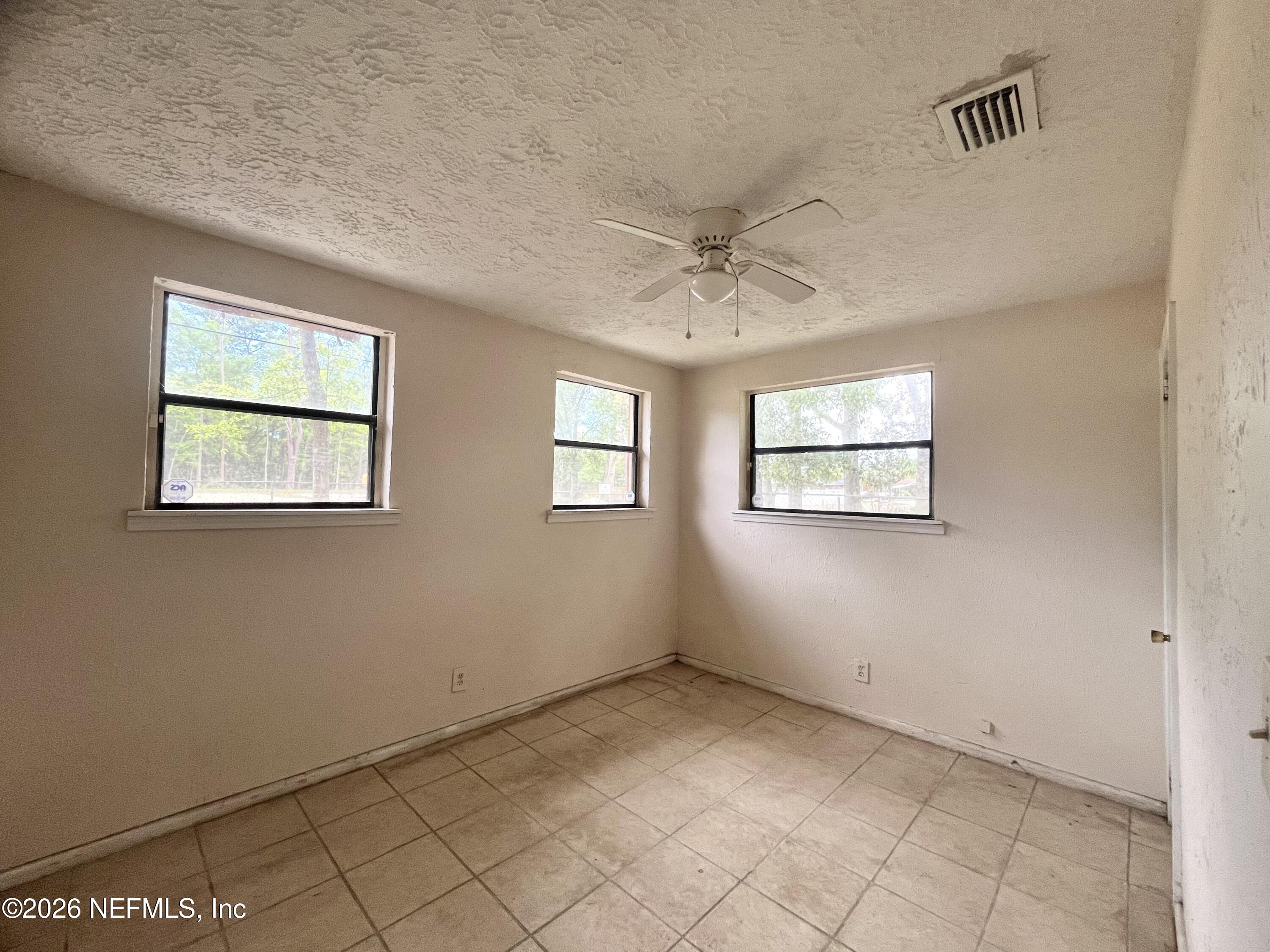 9926 Frankella Road Jacksonville, FL 32208 - Photo 15 of 18 a view of an empty room with a window