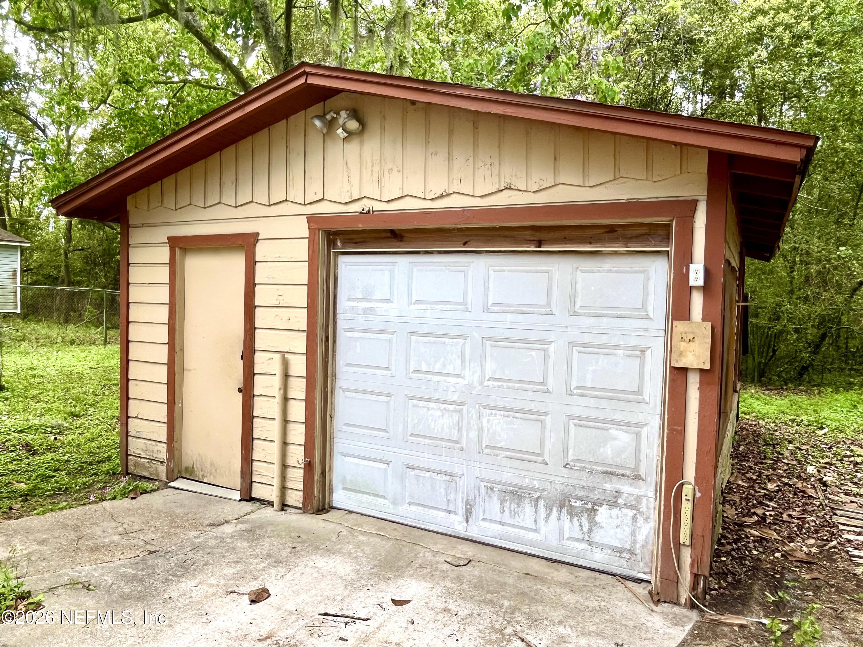 9926 Frankella Road Jacksonville, FL 32208 - Photo 16 of 18 a front view of a house with a yard