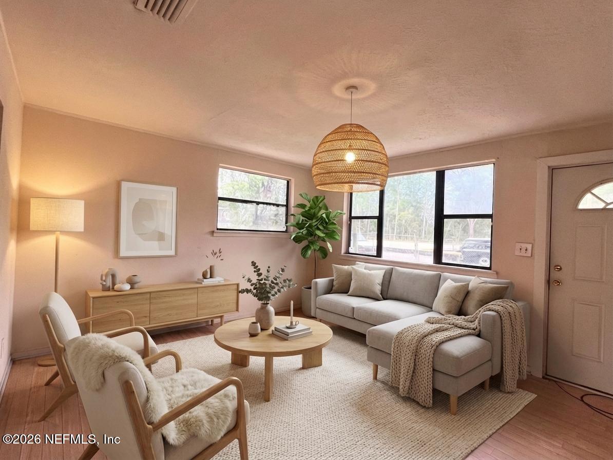 9926 Frankella Road Jacksonville, FL 32208 - Photo 4 of 18 a living room with furniture and a large window
