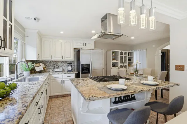a kitchen with a table and chairs in it