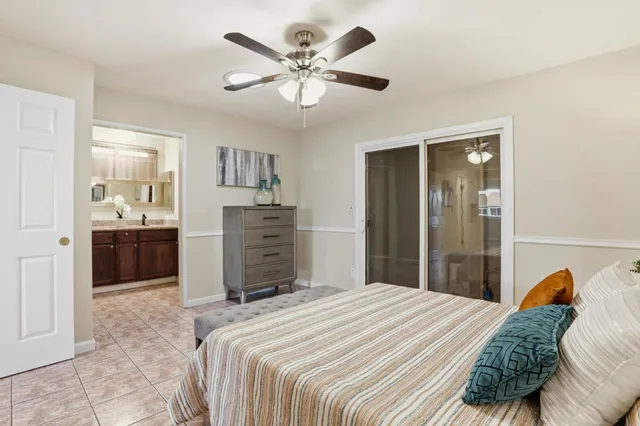 a view of a big room with wooden floor and windows