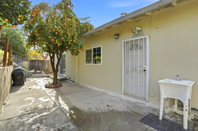 a view of a backyard of the house