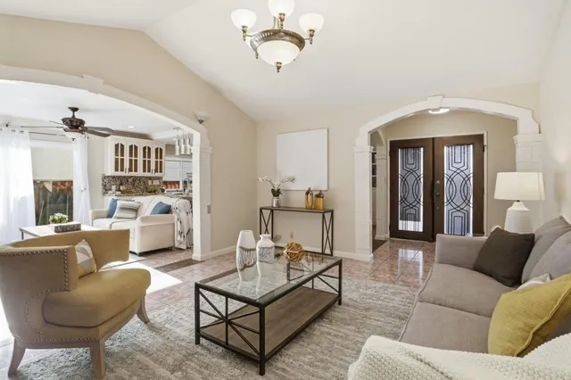 a living room with furniture and a large window