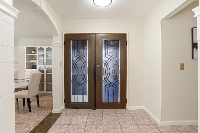 a view of a entryway door with interior of house