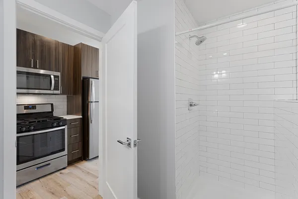 a kitchen with a refrigerator stove and microwave