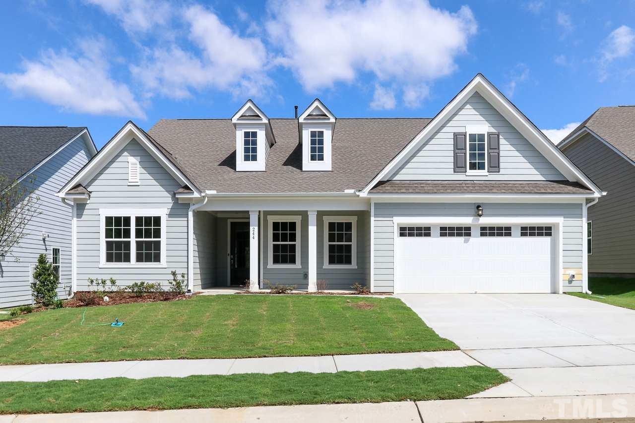 244 Ivory Lane, Unit 72 Raleigh, NC 27610 - Photo 1 of 30 a front view of a house with a yard and garage