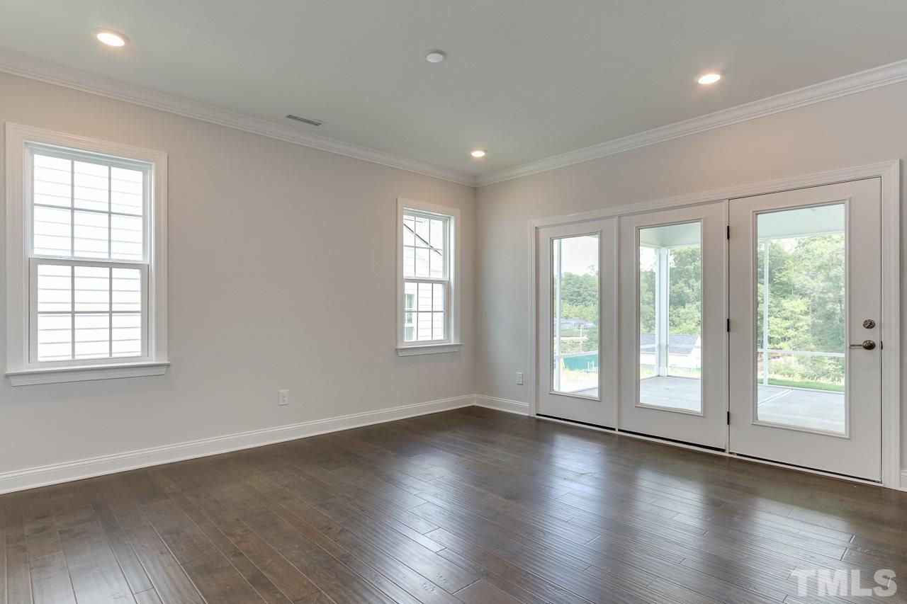 244 Ivory Lane, Unit 72 Raleigh, NC 27610 - Photo 11 of 30 a view of empty room with wooden floor and fan
