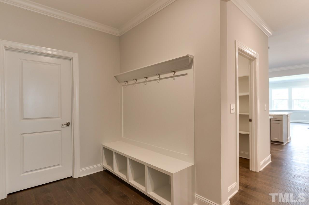 244 Ivory Lane, Unit 72 Raleigh, NC 27610 - Photo 12 of 30 a view of an empty room with wooden floor and a window