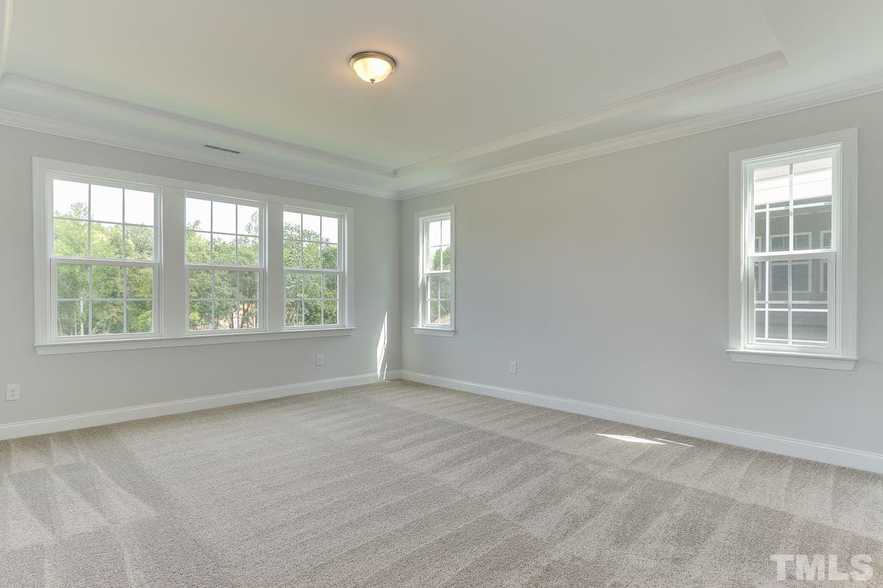 244 Ivory Lane, Unit 72 Raleigh, NC 27610 - Photo 13 of 30 a view of an empty room with a window