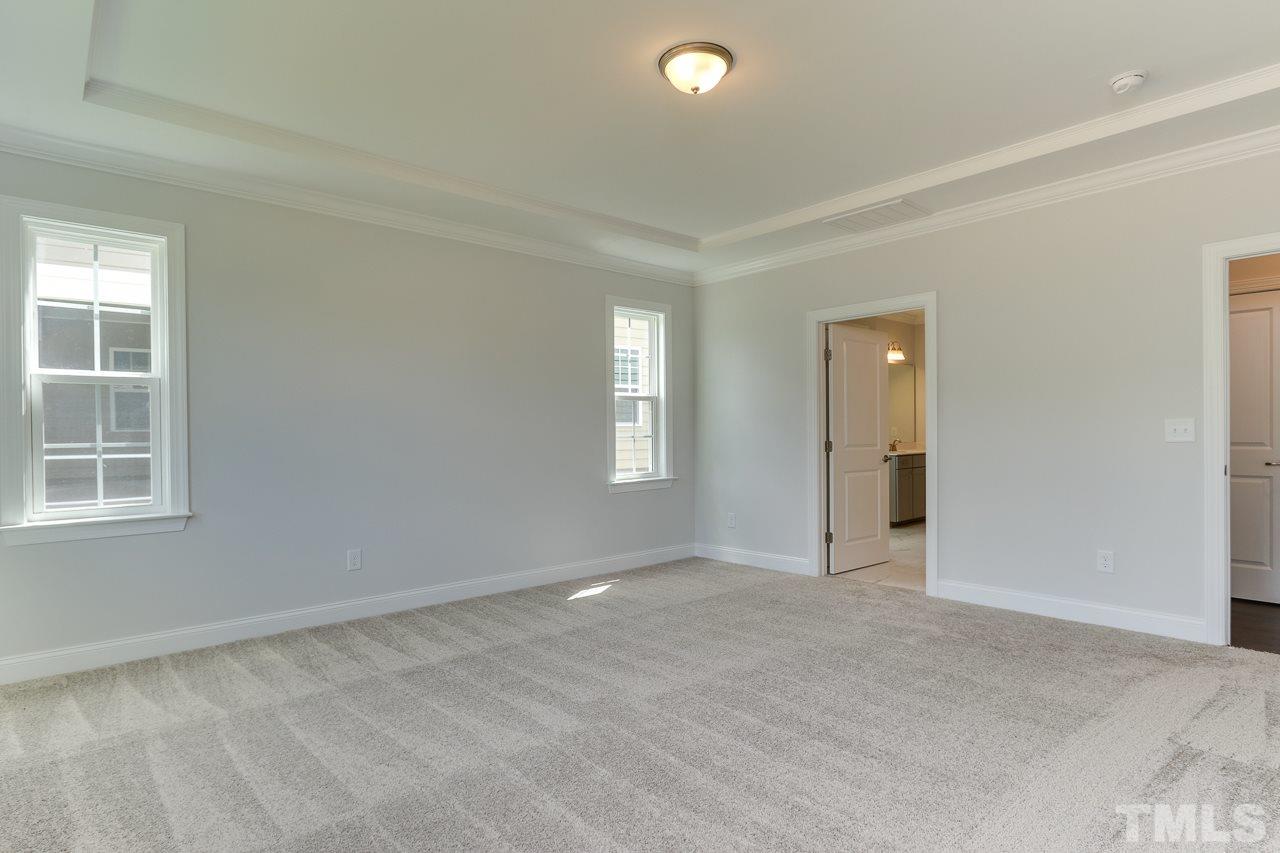 244 Ivory Lane, Unit 72 Raleigh, NC 27610 - Photo 14 of 30 an empty room with windows