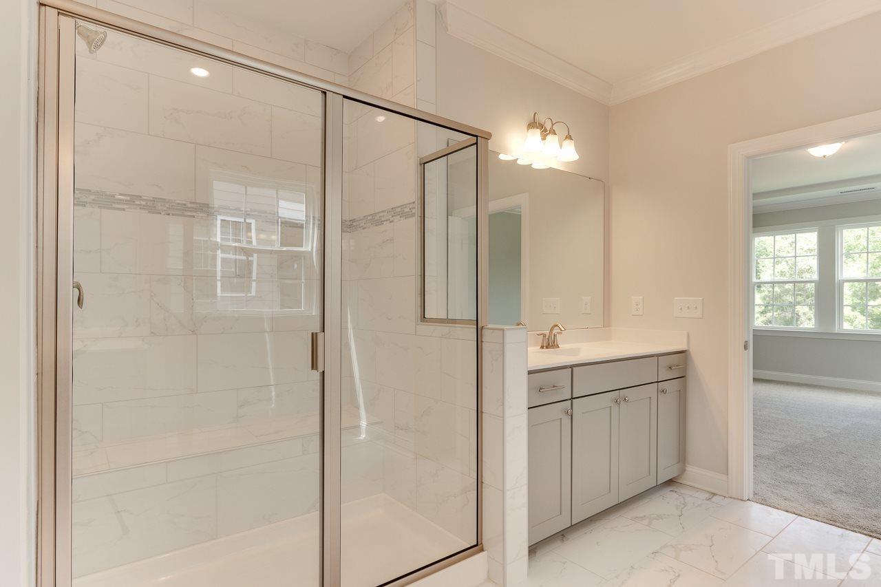 244 Ivory Lane, Unit 72 Raleigh, NC 27610 - Photo 16 of 30 a bathroom with a shower and a sink