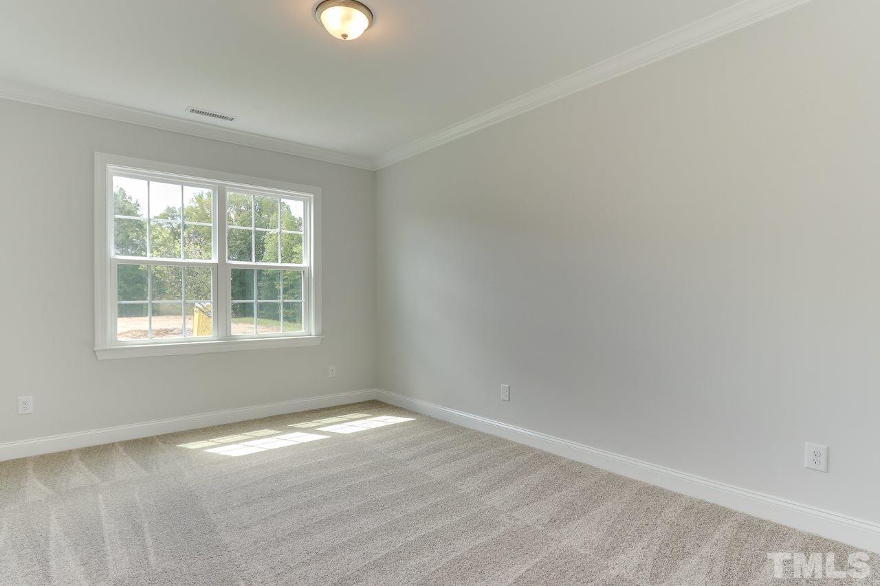 244 Ivory Lane, Unit 72 Raleigh, NC 27610 - Photo 19 of 30 an empty room with a window